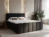 A modern bedroom scene featuring a large, upholstered boxspring bed. Produktbild-Vorschau