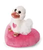 A white plush duck with a pink heart on its chest sits on a pink heart-shaped pillow. Produktbild-Vorschau