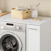 Detailansicht des SoBuy Unterschranks BZR229-W neben Waschmaschine mit Korb und Accessoires Productafbeelding-voorbeeld