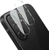 A close-up shot of two clear glass camera lens protectors being placed on the camera module of a black smartphone. Produktbild-Vorschau