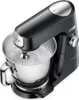 A black Kenwood stand mixer with a silver bowl and attachments is shown on a white background. Voir les images du produit