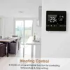 A smart thermostat is mounted on a wall in a modern kitchen/dining area. Náhľad obrázku produktu