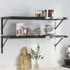 Two black metal wall shelves are mounted on a white tiled wall, displaying various kitchen items. Anteprima dell’immagine prodotto