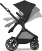 A black Cybex Eos Lux stroller is shown in profile against a white background. The stroller's canopy and handle are adjustable, as indicated by the ghosted images showing different positions. Voir les images du produit