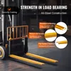 A forklift with yellow fork extensions in a warehouse setting. Náhľad obrázku produktu