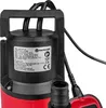 Close-up of a submersible pump, showing its top and a portion of its body, with visible labels and cables. Podgląd zdjęcia produktu