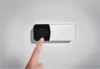 A finger pressing a doorbell button. Produktbild-Vorschau