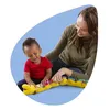 A woman and a baby are playing with a musical worm toy. Produktbild-Vorschau