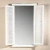 A mirror with shutter-like side panels, set against a textured wall. Náhľad obrázku produktu