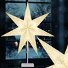 A lit-up star decoration is placed on a window sill with a snowy scene visible through the window. Produktbild-Vorschau