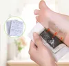 A person is applying a detox foot pad to their foot. Produktbild-Vorschau