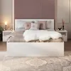 A bedroom scene with a bed, nightstands, and a rug. Produktbild-Vorschau