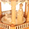 A close-up view of a wooden Christmas pyramid with carved figures. Produktbild-Vorschau