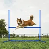 A dog jumping over an agility hurdle in a grassy outdoor area. Náhled obrázku produktu