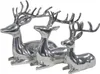 Three silver-colored deer figurines are arranged in a row, facing left. The largest deer is in the back, with two smaller deer in front of it. Produktbild-Vorschau