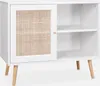 A white sideboard with a rattan door and wooden legs, shown against a white background. Anteprima dell’immagine prodotto