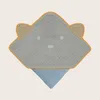 A hooded baby towel shaped like a bear's face, displayed against a plain background. Náhled obrázku produktu