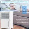 A child sleeping on a couch next to a white dehumidifier. Produktbild-Vorschau