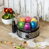 Easter-themed image with dyed eggs in an egg cooker. Produktbild-Vorschau
