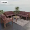 An outdoor patio set with cushions and a coffee table, overlooking a body of water and mountains. Produktbild-Vorschau