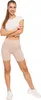 A woman is posing in athletic wear against a white background. Produktbild-Vorschau