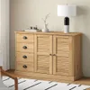 A wooden sideboard with drawers and louvered doors, placed against a light-colored wall. Voir les images du produit