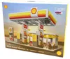 The image shows the box of a building block set depicting a Shell gas station. Podgląd zdjęcia produktu