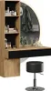 A vanity table with a mirror, stool, and various cosmetic items. Voir les images du produit
