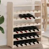 A wooden wine rack filled with wine bottles. Podgląd zdjęcia produktu