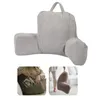 A collage of images showing a gray corduroy backrest pillow with armrests, including a close-up of someone using it to hold a book and another image of someone holding it. Náhled obrázku produktu
