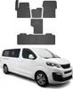 A white van with a set of black rubber floor mats displayed above it. Anteprima dell’immagine prodotto
