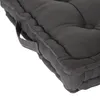 A close-up view of a dark gray floor cushion, showing its texture and stitching. Produktbild-Vorschau