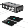 A car charger adapter with USB ports and cigarette lighter sockets, shown connected to two smartphones that are charging. Podgląd zdjęcia produktu