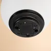 The underside of a solar-powered light fixture, showing the mounting base and electrical connections. Produktbild-Vorschau