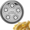 A close-up of a pasta cutter attachment and a pile of macaroni pasta. Náhled obrázku produktu