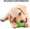 A puppy playing with a green ball. Náhled obrázku produktu