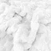 A close-up view of a white textured blanket. Náhled obrázku produktu