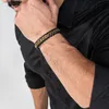 A man's arm wearing a bracelet. Produktbild-Vorschau