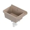 A beige sink with plumbing attached, shown against a white background. Anteprima dell’immagine prodotto