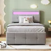 A child's bedroom with a bed, decorative clouds, and a toy car. Produktbild-Vorschau
