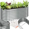 A raised garden bed filled with plants, along with gardening gloves and a part of the raised bed kit. Produktbild-Vorschau