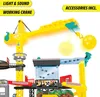 A toy construction playset featuring a large yellow crane with a wrecking ball, a building structure with a transparent tube, and various construction vehicles depicted on a sign. Produktbild-Vorschau
