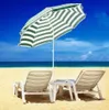 A beach scene with two lounge chairs and a striped umbrella. Produktbild-Vorschau