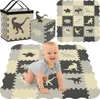 A baby is crawling on a play mat made of interlocking foam tiles with dinosaur designs. There is also a cube made of similar tiles and a storage bag in the background. Náhľad obrázku produktu