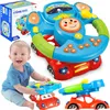A baby is playing with a toy steering wheel that is attached to a toy car. The toy has lights and sounds. There is also a box for the toy in the background. Náhľad obrázku produktu
