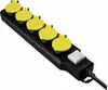 A black power strip with five yellow covered outlets and a white switch, isolated on a white background. Produktbild-Vorschau