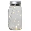 A clear, studio shot of a solar-powered mason jar lantern. Produktbild-Vorschau