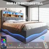 A modern bedroom with a grey upholstered bed frame featuring integrated LED lighting and a headboard with shelving. Náhľad obrázku produktu
