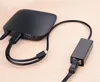 A black Ugreen adapter is shown connected to cables on a wooden surface. Voir les images du produit