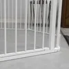 A close-up view of the bottom section of a white metal pet playpen, showing its base and vertical bars on a concrete floor. Produktbild-Vorschau